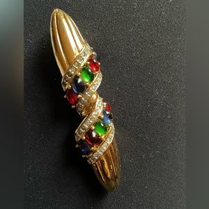 Vintage brooch with red blue and green stones